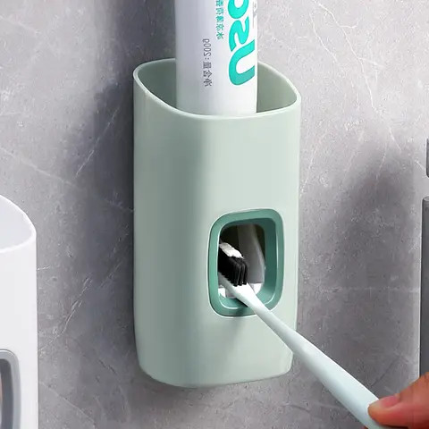 Toothbrush and toothpaste dispenser and holder - green
